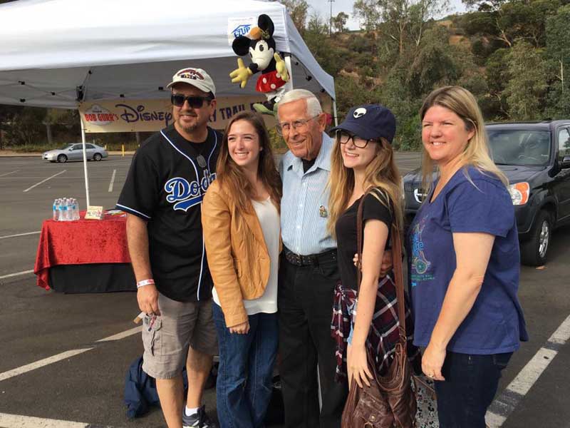 Guests taking a photo with Bob Gurr