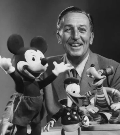 Walt Disney with character figurines
